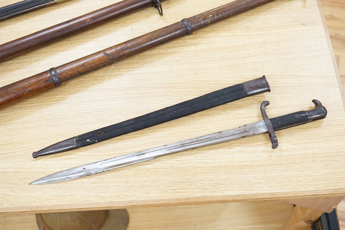 A Prussian M1865 bayonet and scabbard, blade marked with A&AS (for August & Albert Schnitzier), and Wilhelm I crown